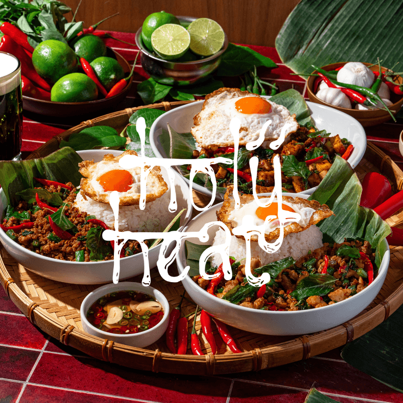 Holy Heat Pad Kra Pow bowls with Thai basil stir-fry, white rice, and crispy fried eggs, surrounded by fresh chilies, limes, and garlic, with “Holy Heat” text overlaid.