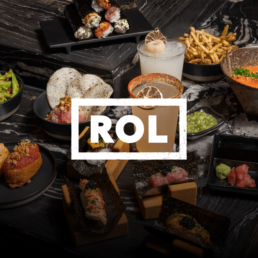 ROL Hand Roll Bar logo overlaid a spread from ROL Hand Roll Bar featuring assorted hand rolls topped with fresh fish and caviar, spicy edamame, appetizers, fries, dipping sauces, and signature cocktails arranged on a dark marble table.